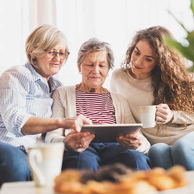 older mother with her adult daughter and granddaughter planning their estate